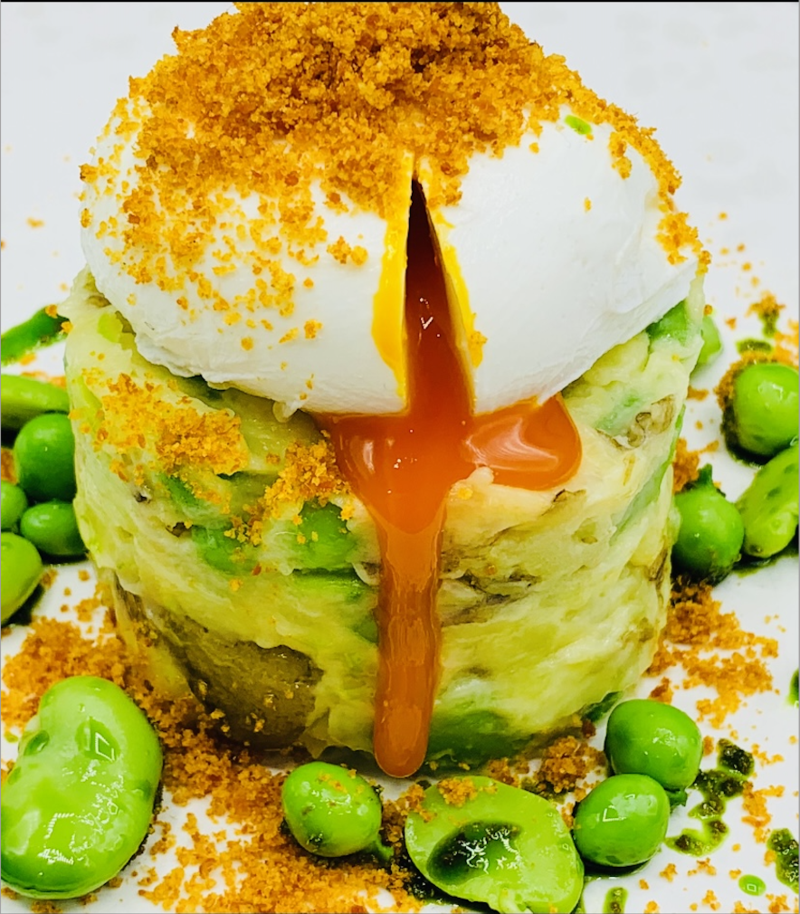 Crushed Jersey Royals, garden peas, feves, poached cacklebean egg and chorizo crumb.